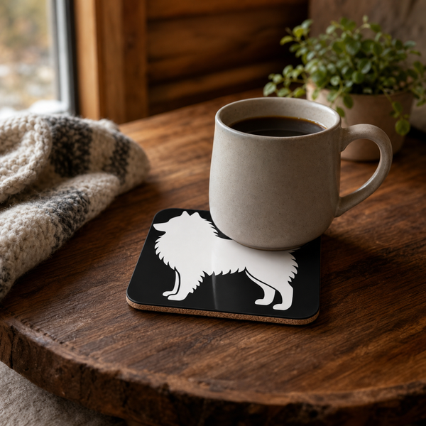 White Finnish Lapphund Silhouette Lapphund Designs Logo Cork-Back Coaster Finnish Lapphund cork-back coaster in use on a table