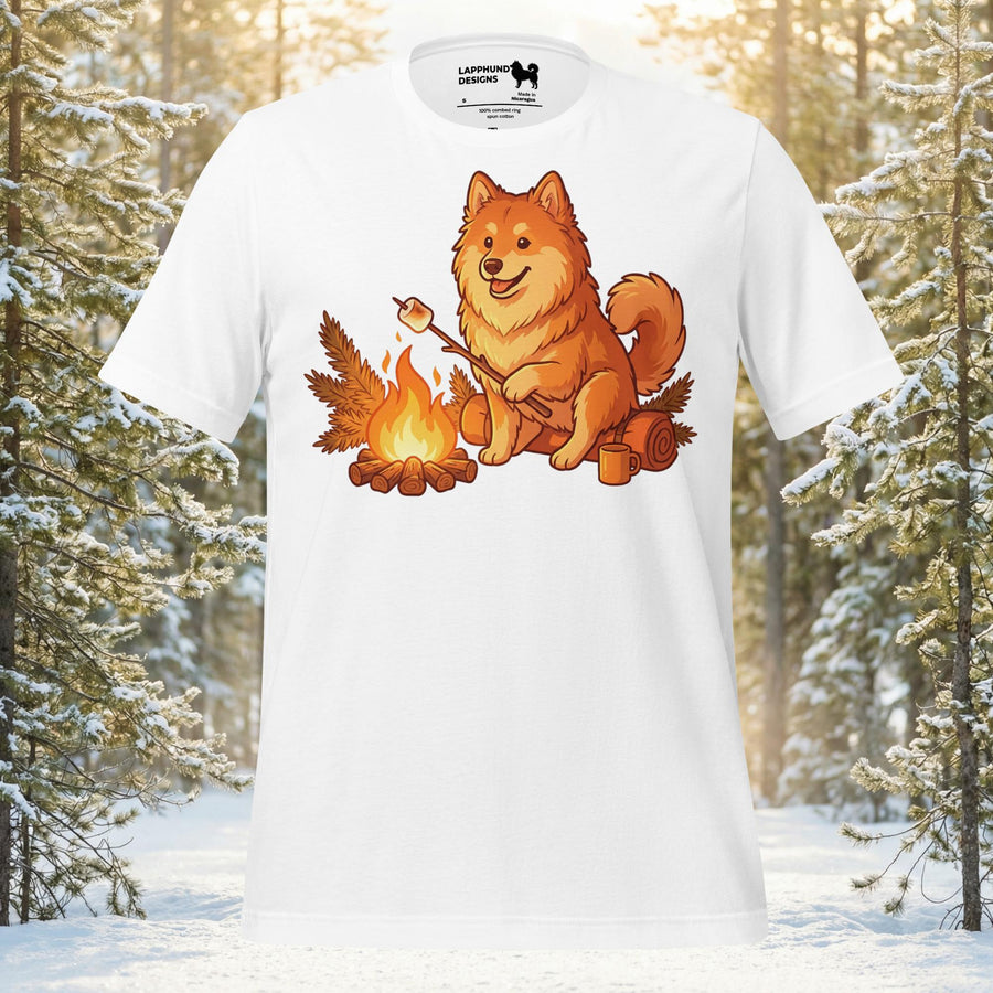 Finnish Lapphund sitting by a campfire roasting a marshmallow with a fluffy tail and alert expression for outdoor adventure lovers.