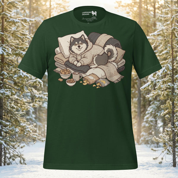 Finnish Lapphund wearing a hoodie sitting on a pile of blankets with hot cocoa and snacks on a premium cotton t-shirt.