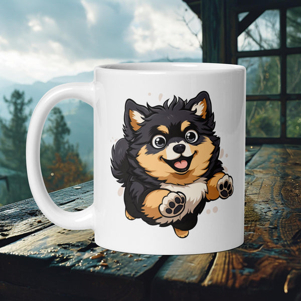 Finnish Lapphund Mug with a playful black-and-tan puppy Lappie leapingβideal for Nordic dog lovers and gift seekers.
