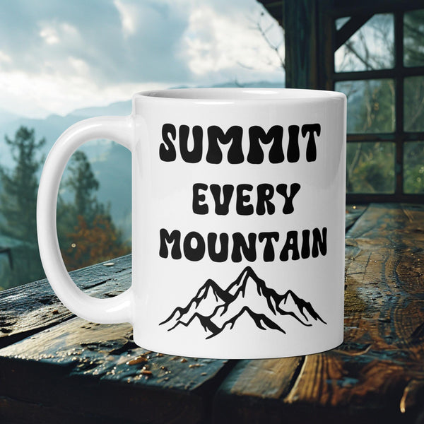 Finnish Lapphund Mug with "Summit Every Mountain" text and mountain range—ideal for dog owners and adventure seekers.
