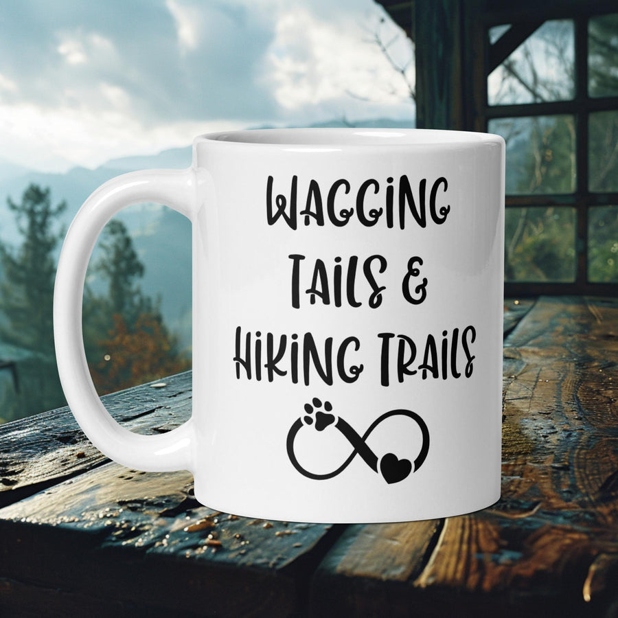 Finnish Lapphund Mug with "Wagging Tails & Hiking Trails" text and infinity paw print—ideal for dog lovers and hikers.