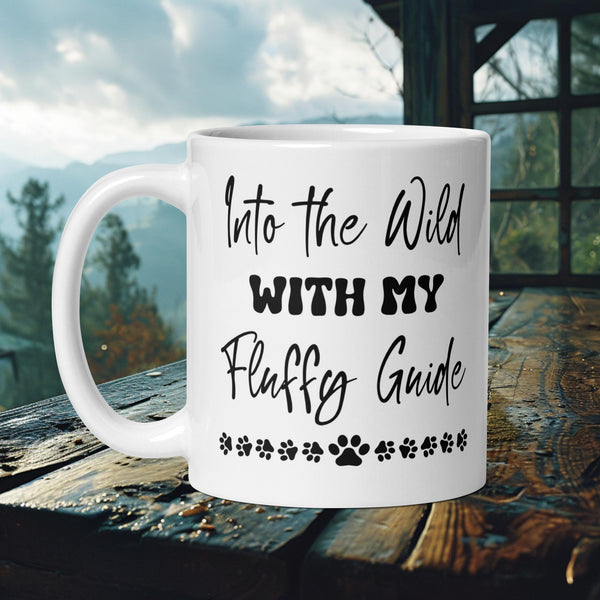 Finnish Lapphund Mug with "Into the Wild With My Fluffy Guide" text and paw print stars—ideal for pet fans and adventurers.