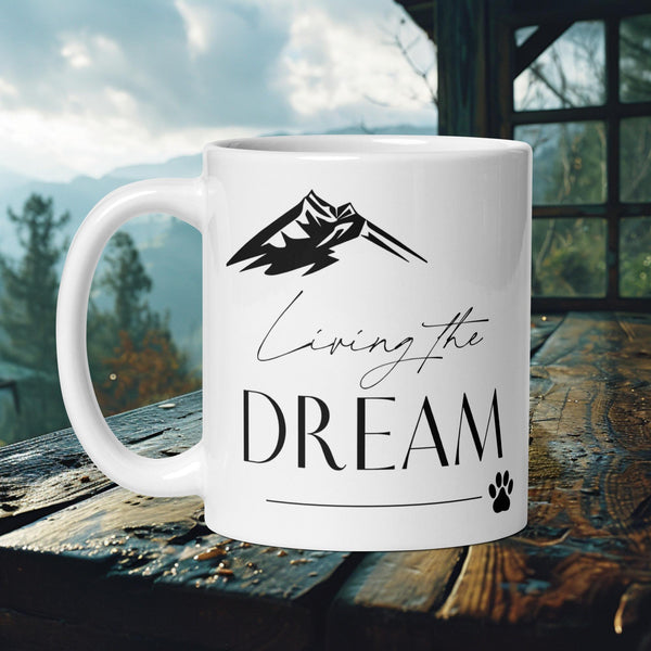 Finnish Lapphund Mug with "Living the Dream" text, mountain, and paw print—ideal for dog lovers and dreamers.