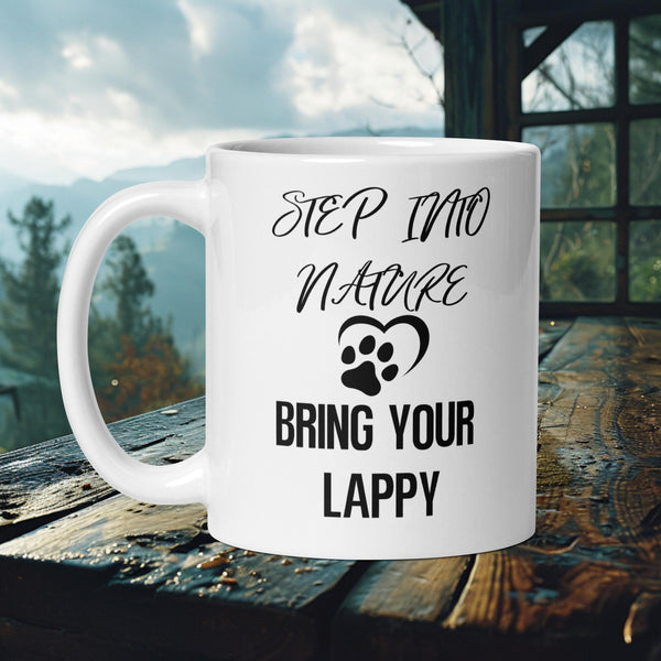 Finnish Lapphund Mug with "Step Into Nature, Bring Your Lappy" text and heart paw print—ideal for dog moms and nature lovers.