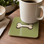 Finnish Lapphund Bone Icon Cork-Back Coaster Finnish Lapphund cork-back coaster in use on a table