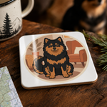 Glossy print detail on the Finnish Lapphund Cozy Cabin Illustration Cork-Back Coaster Finnish Lapphund coaster
