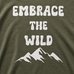 Embrace the Wild Finnish Lapphund T-Shirt - Bold Outdoor Apparel design close-up on a Finnish Lapphund t-shirt