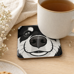 Finnish Lapphund Black and White Face Cork-Back Coaster Finnish Lapphund cork-back coaster in use on a table