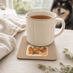 Dog Treat Jar Illustration Cork-Back Coaster for Finnish Lapphund Lovers Finnish Lapphund cork-back coaster in use on a table