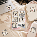 Finnish Lapphund Goofy Surprise Sticker Sheet – Wide Eyes, Funny Faces & Playful Shock Finnish Lapphund stickers applied in real use
