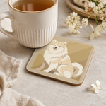Finnish Lapphund Cream Sitting Illustration Cork-Back Coaster Finnish Lapphund cork-back coaster in use on a table