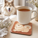 Finnish Lapphund Cream Cozy Illustration Cork-Back Coaster Finnish Lapphund cork-back coaster in use on a table