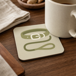 Finnish Lapphund Collar & Leash Icon Cork-Back Coaster Finnish Lapphund cork-back coaster in use on a table