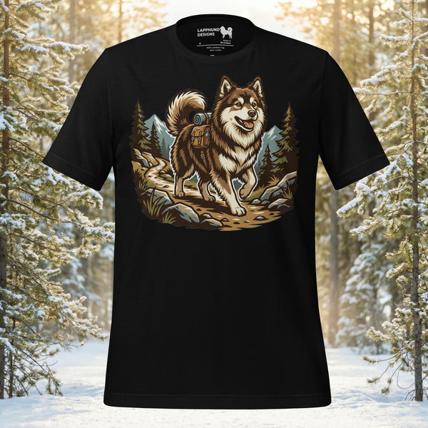 Finnish Lapphund hiking along an alpine trail through forest scenery on a black graphic t-shirt
