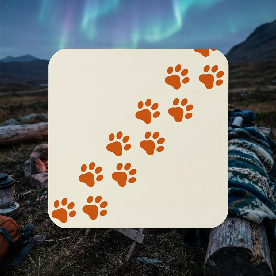 Minimalist Finnish Lapphund paw trail cork-back coaster with diagonal paw print design