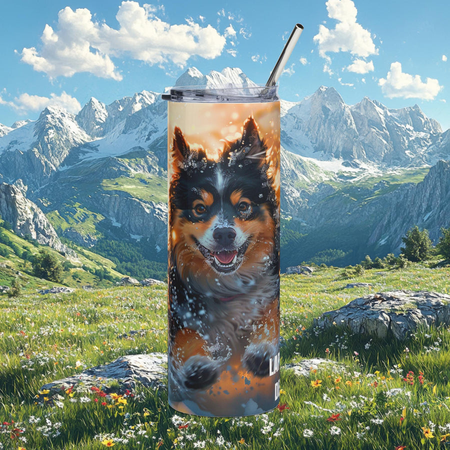 Finnish Lapphund running through snow tumbler 20oz