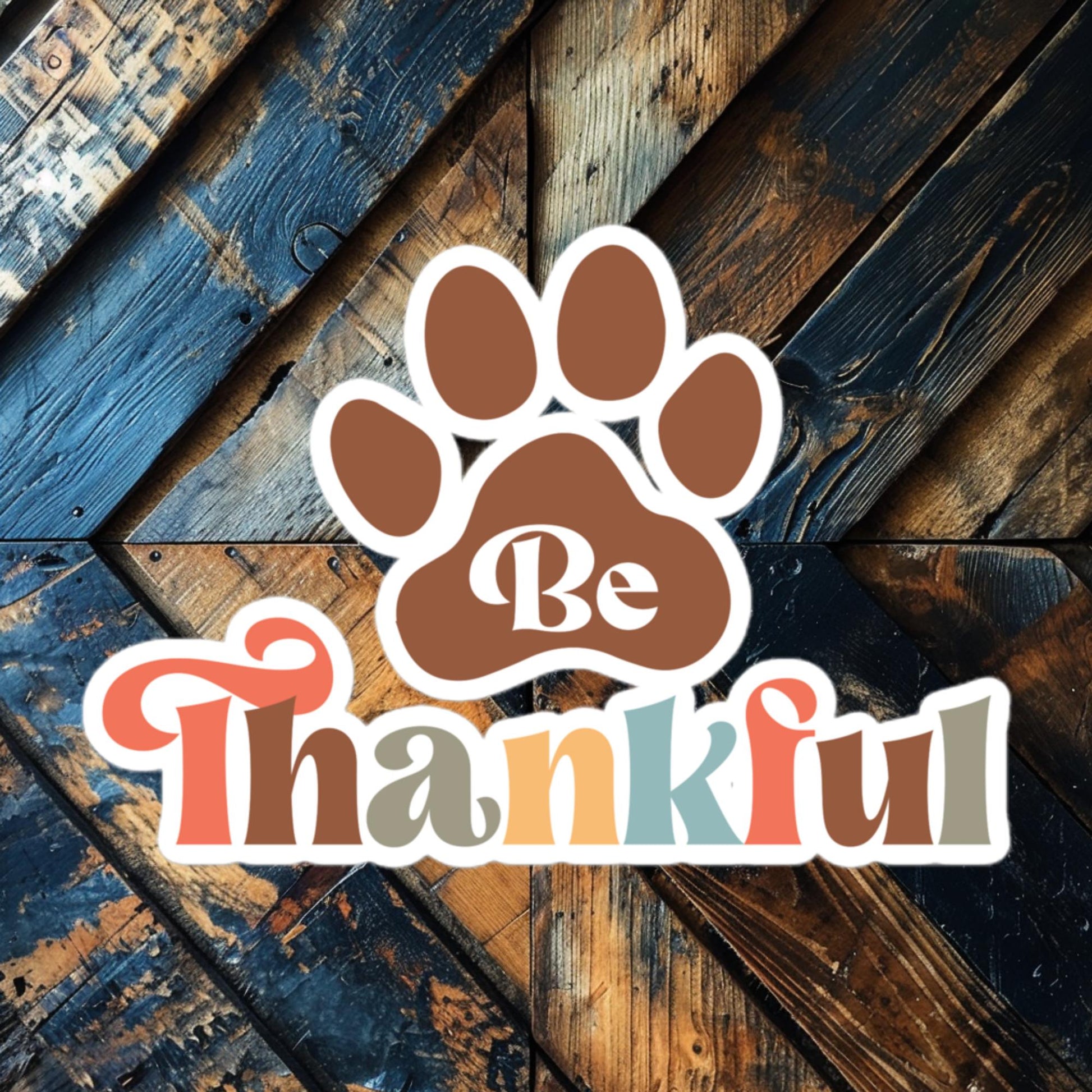 Be Thankful Paw vinyl sticker featuring a paw print and autumn colors, perfect for dog lovers and pet owners.