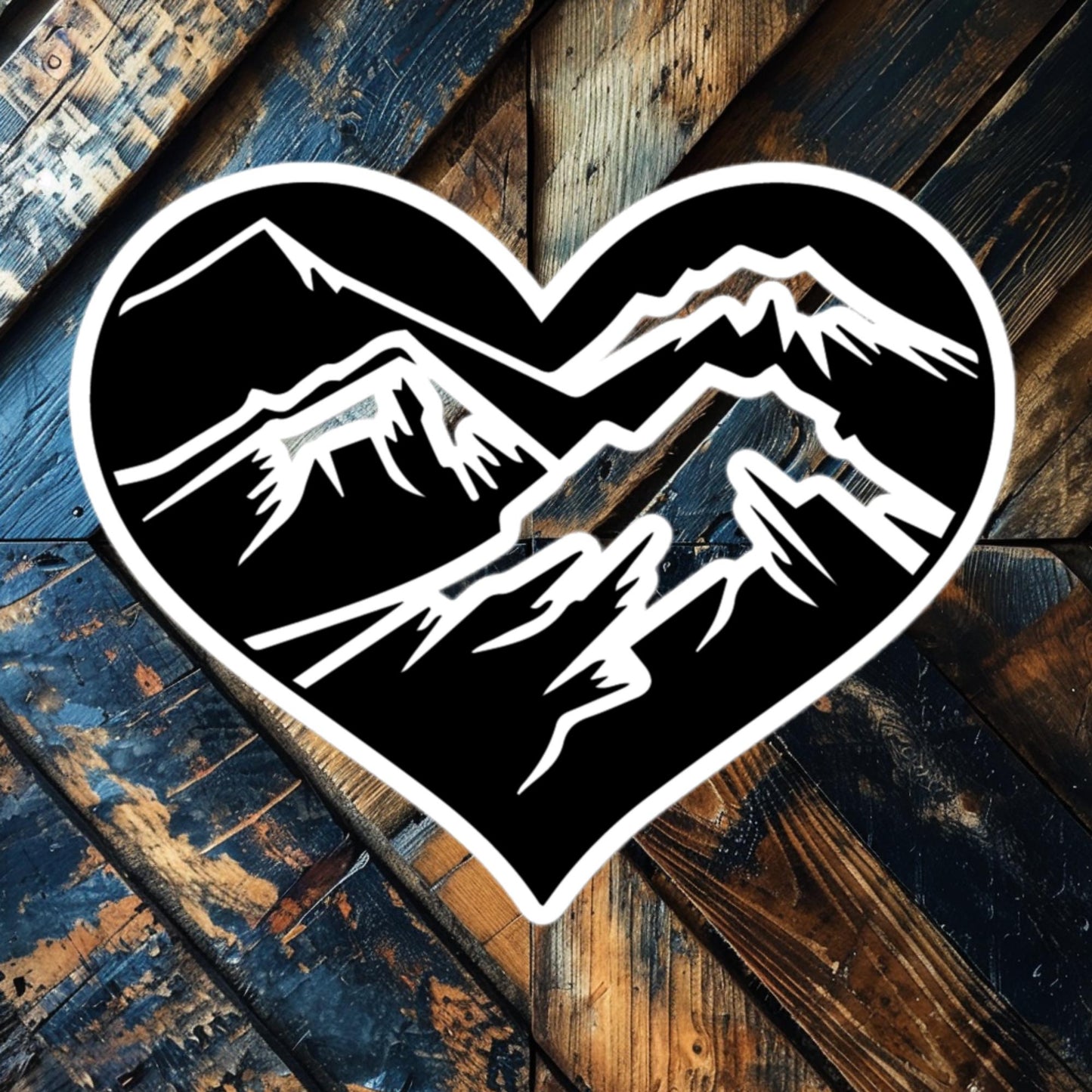 Mountain Heart vinyl sticker featuring jagged mountain peaks inside a heart, perfect for nature lovers and adventurers.