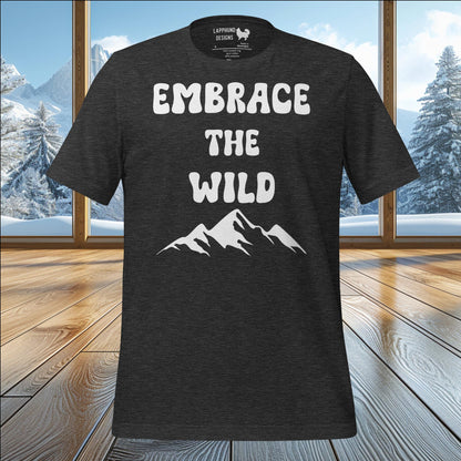 Embrace the Wild t-shirt featuring bold text and rugged mountain graphic, perfect for nature lovers and outdoor adventurers.