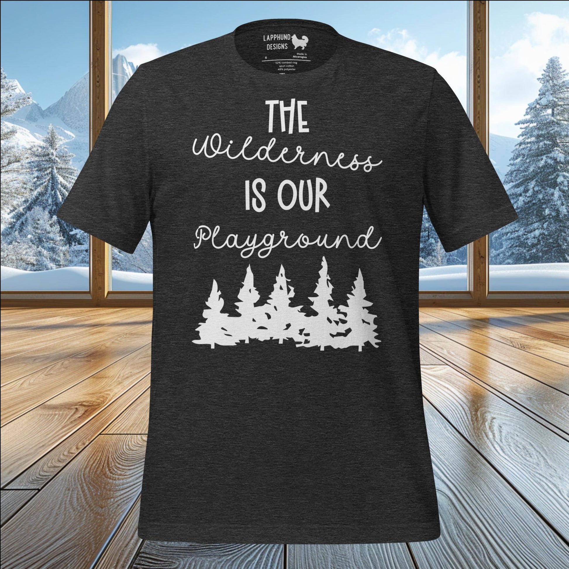 The Wilderness is Our Playground t-shirt featuring forest silhouette and nature-inspired design, perfect for outdoor enthusiasts.