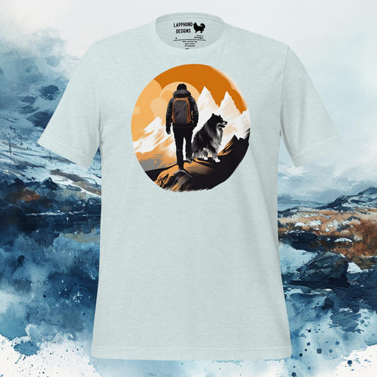 T-shirt featuring a hiker and Finnish Lapphund silhouetted against a mountain backdrop, ideal for nature-loving and adventure-seeking dog owners.