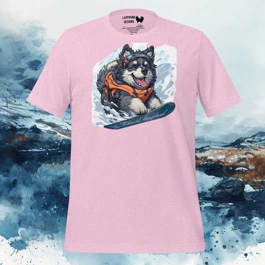 Light pink t-shirt featuring a Finnish Lapphund running through a snowy landscape wearing an orange scarf, perfect for winter-loving dog owners.