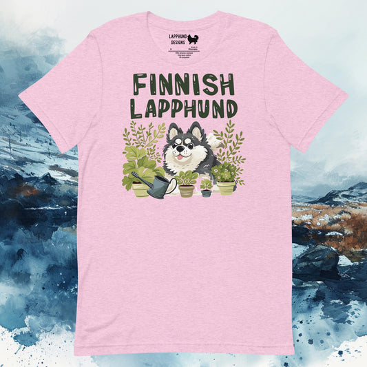 Light pink t-shirt featuring a Finnish Lapphund surrounded by potted plants, perfect for plant and dog lovers with a green thumb.