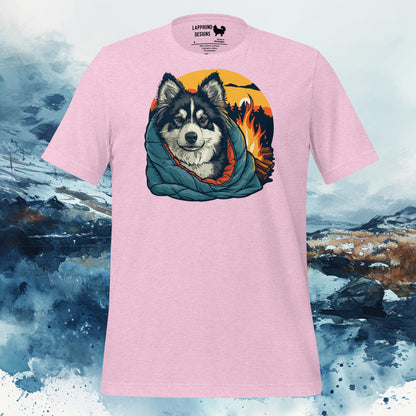 T-shirt featuring a Finnish Lapphund wrapped in a blanket by a campfire, perfect for nature-loving and adventure-seeking dog owners.