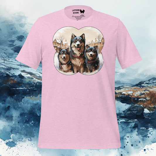 Pink t-shirt featuring three Finnish Lapphunds in a snowy winter scene, ideal for Lapphund families and dog enthusiasts.