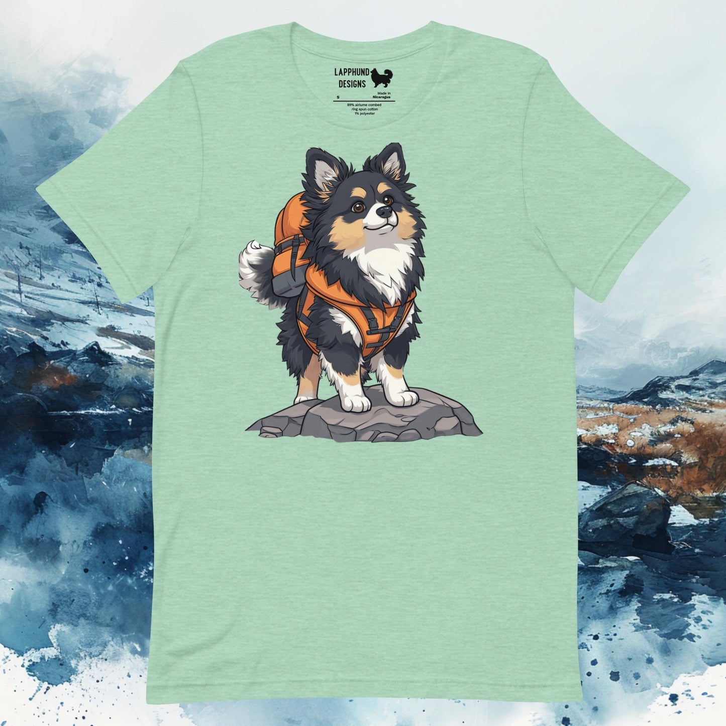 Light green t-shirt featuring a Finnish Lapphund with an orange backpack standing on rocky terrain, perfect for outdoor-loving dog owners.