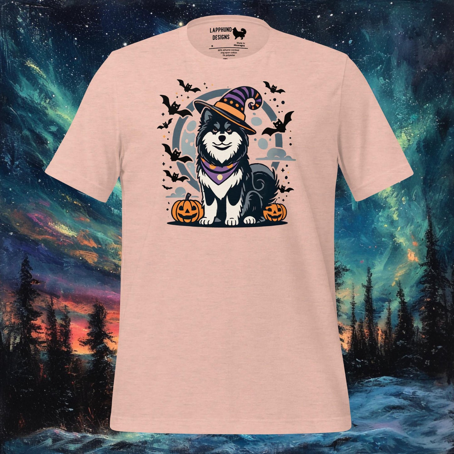 Peach t-shirt featuring a Finnish Lapphund in a witch’s hat with pumpkins and bats, perfect for Halloween and dog lovers.