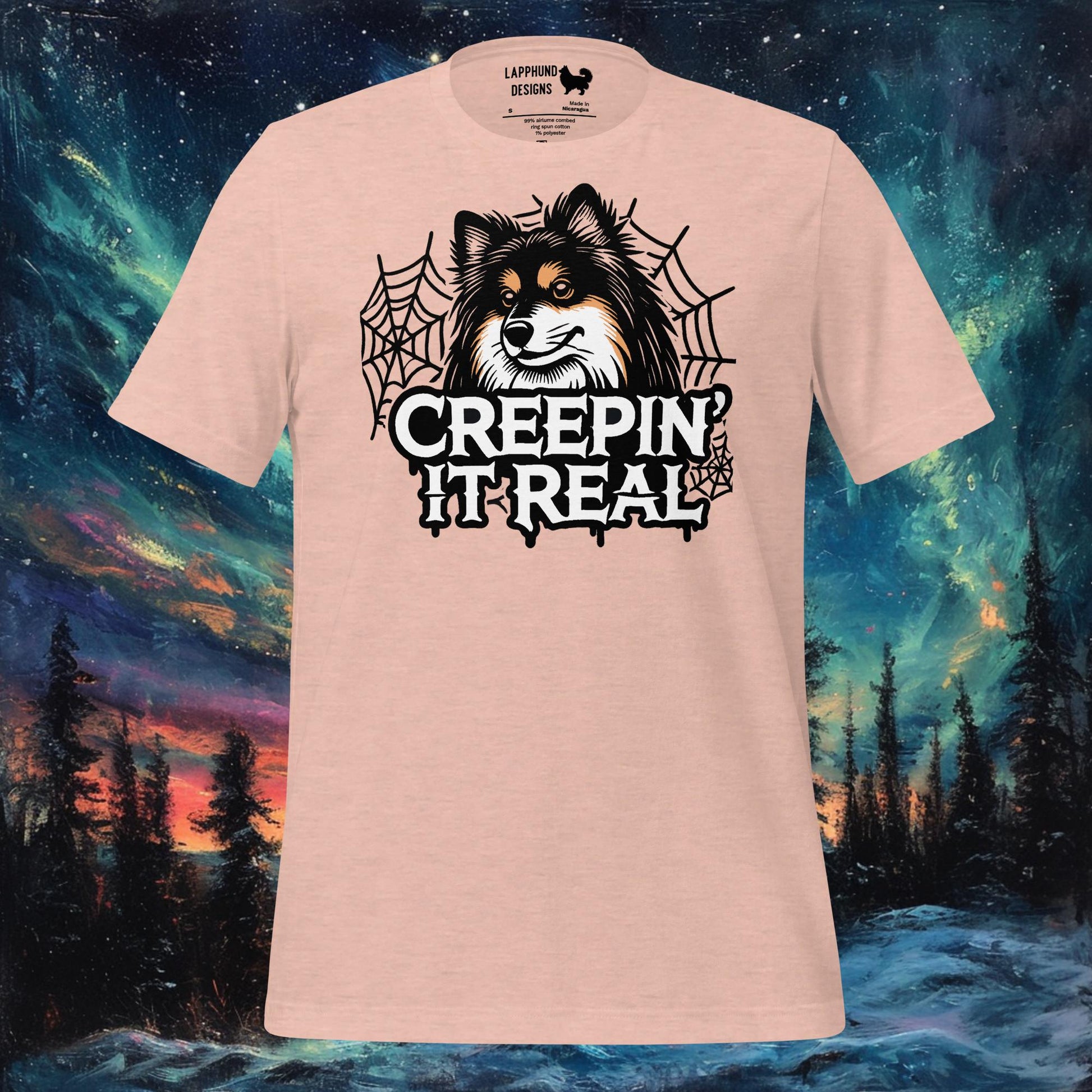 Peach t-shirt featuring a Finnish Lapphund surrounded by spider webs with 'Creepin' It Real' text, perfect for Halloween and dog lovers.