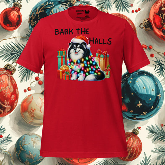 Festive Finnish Lapphund Christmas t-shirt featuring a Lapphund wrapped in lights and surrounded by gifts, perfect for holiday celebrations.