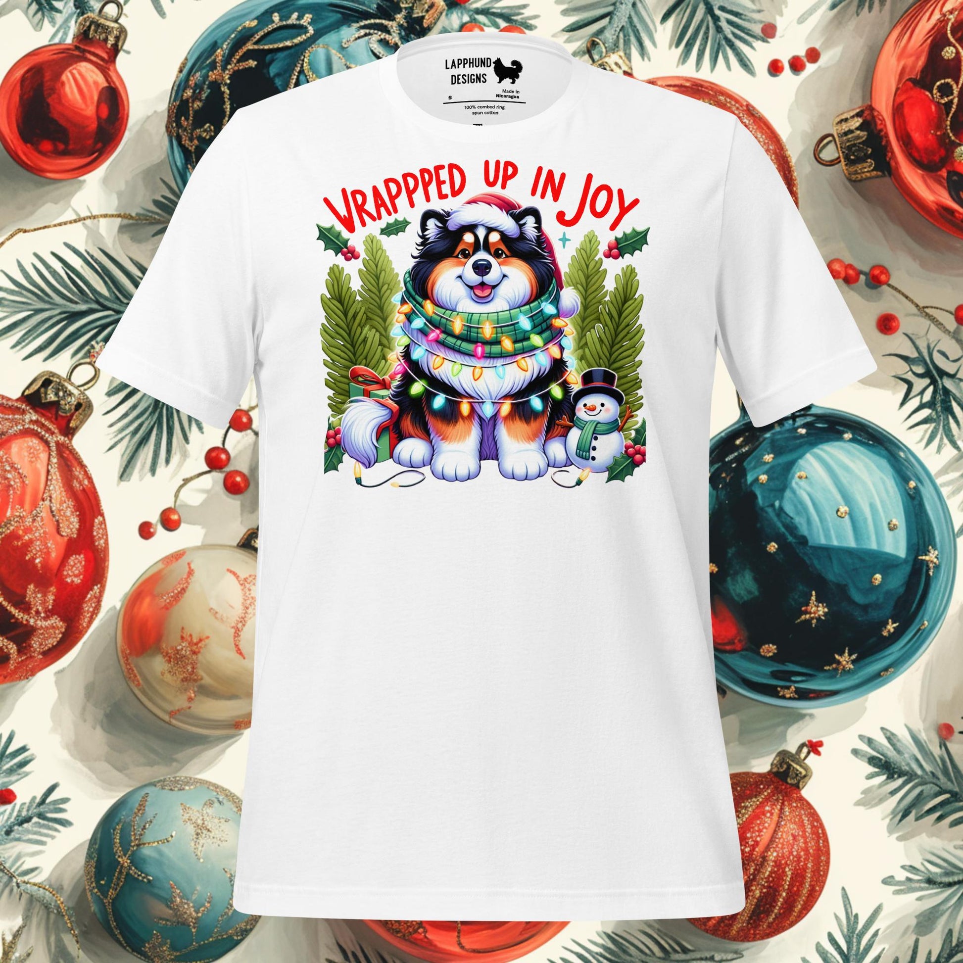 Wrapped Up in Joy Finnish Lapphund Christmas t-shirt featuring a cheerful Lapphund wrapped in holiday lights with festive decorations.