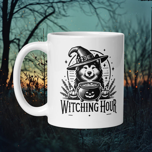 Mug featuring a Finnish Lapphund in a witch costume stirring a cauldron with the text 'Witching Hour,' perfect for Halloween enthusiasts.