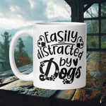 Finnish Lapphund Mug with "Easily Distracted by Dogs" text and heart paw prints—ideal for dog lovers and humor fans.  

