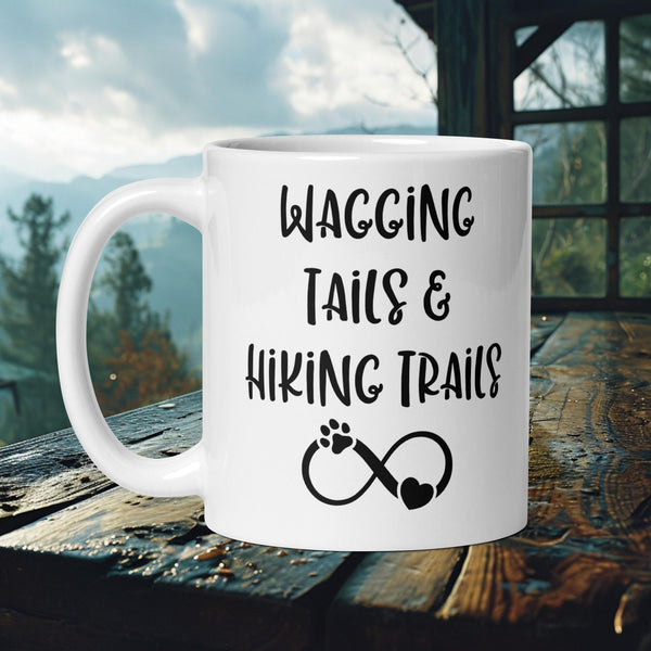 Finnish Lapphund Mug with "Wagging Tails & Hiking Trails" text and infinity paw print—ideal for dog lovers and hikers.  

