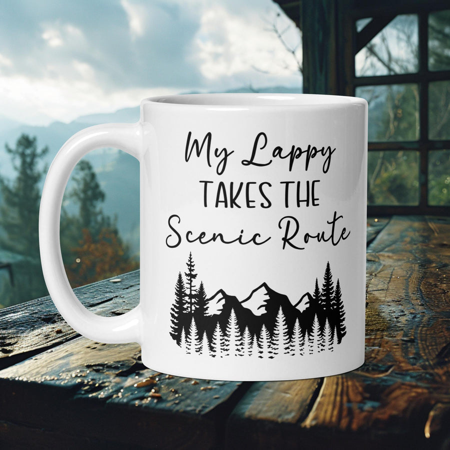 Finnish Lapphund Mug with "My Lappy Takes the Scenic Route" text and mountain tree silhouette—ideal for dog owners and travel lovers.  

