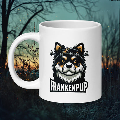 White ceramic mug featuring a Finnish Lapphund as a friendly Halloween monster with the text 'Frankenpup,' perfect for Halloween enthusiasts.