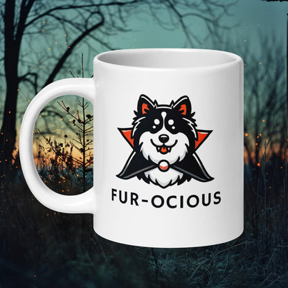 White ceramic mug featuring a Finnish Lapphund in a vampire costume with the text 'Fur-ocious,' perfect for Halloween enthusiasts.