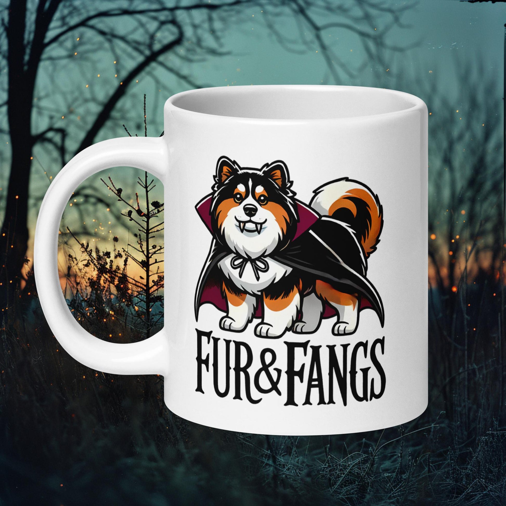 White ceramic mug featuring a Finnish Lapphund in a vampire cape with the text 'Fur & Fangs,' perfect for Halloween and dog lovers.